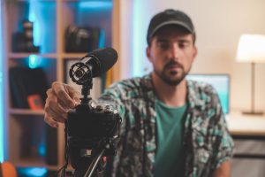 Handsome man with beard shooting a video for social media